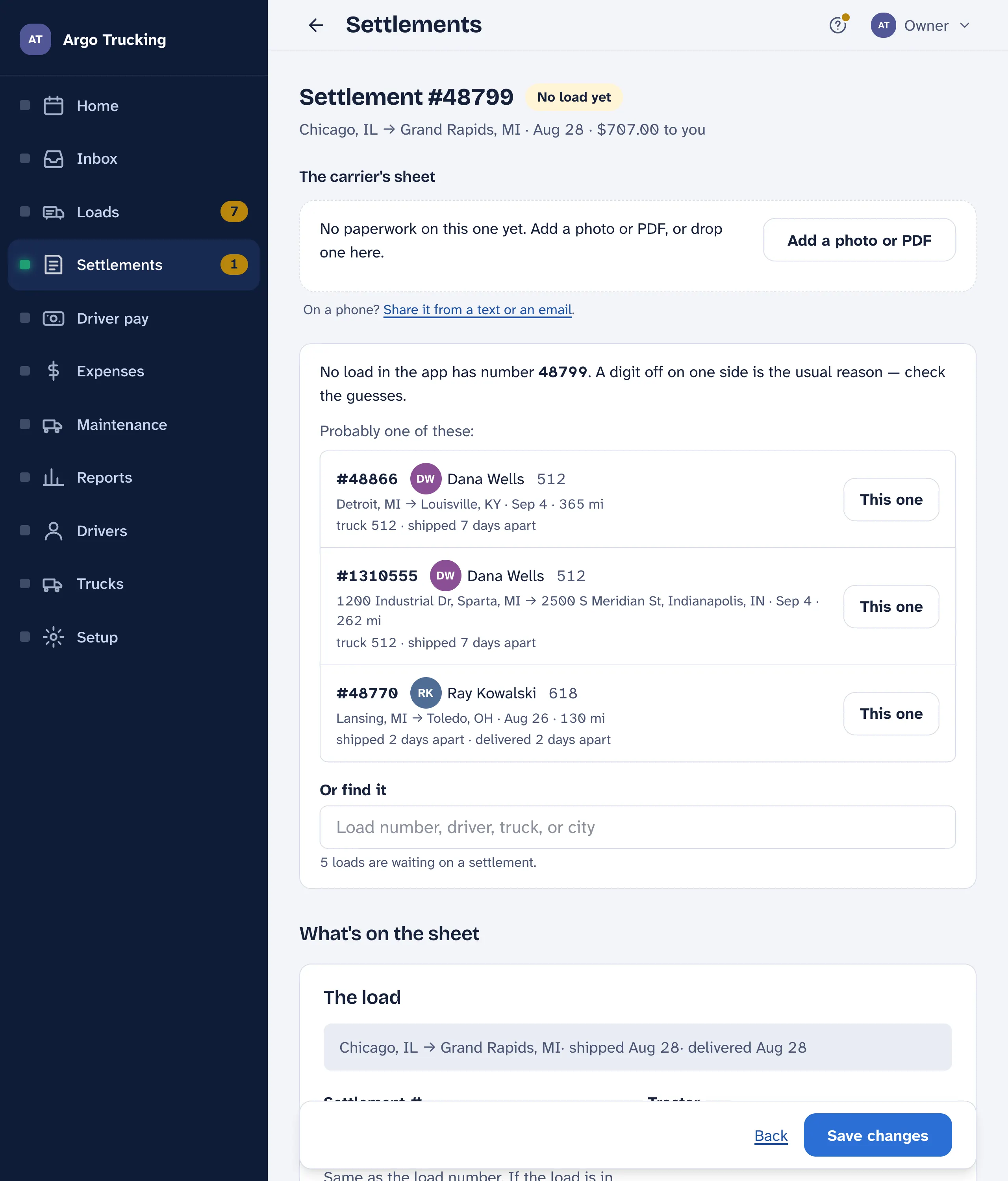A settlement with no load yet: the app lists two probable loads with why — same truck, shipped a week apart — each with a This one button, and a search box to find a load by number, driver, truck or city.